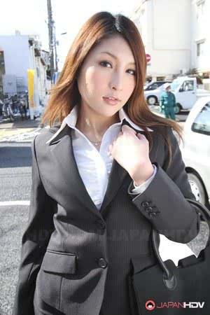 Hot redhead Japanese girl in suit poses to show her beautiful face