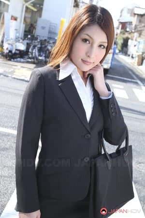 Hot redhead Japanese girl in suit poses to show her beautiful face