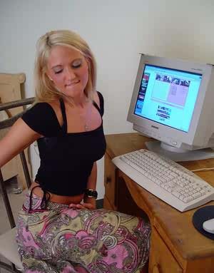 Young blonde girl Spring Thomas masturbates while watching porn on computer