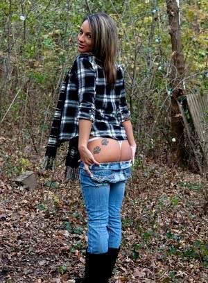 Solo girl Nikki Sims strips to a long scarf and her boots out in the woods