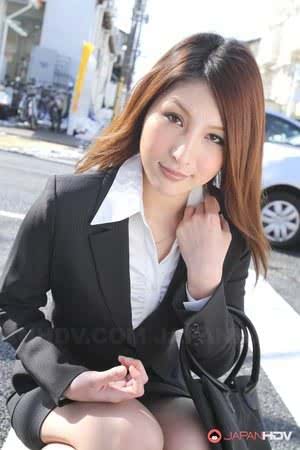 Hot redhead Japanese girl in suit poses to show her beautiful face