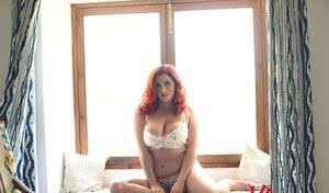 Fat redhead Lucy V unveils her hooters in white underwear