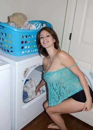 Amateur model Talia Shepard uncovers her knockers while doing laundry