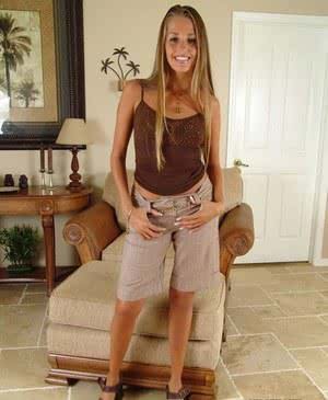 Leggy MILF Lori Anderson slips off long shorts before exposing tiny titties