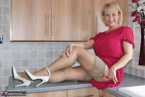 Blonde mature woman Sugarbabe spreading ass to finger  toy in the kitchen