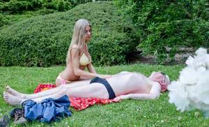 Young blonde girl brings an old man back to life by fucking him on a blanket