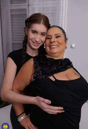 Chubby housewife with massive tits dominates pretty lesbian teen