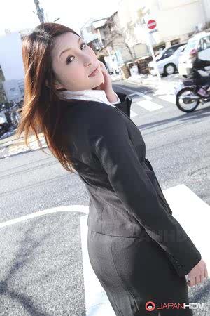 Hot redhead Japanese girl in suit poses to show her beautiful face