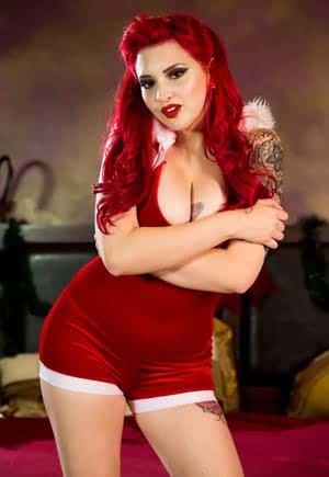 Hot redhead with big tits Amber Ivy showing her tattoos after shedding costume