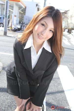 Hot redhead Japanese girl in suit poses to show her beautiful face