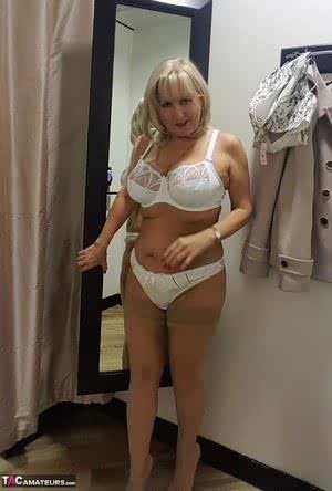 Chubby mature wife Lorna Blu changes form white to red to black sexy lingerie