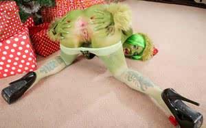 Solo model Joanna Angel showing off pussy and asshole dressed as Green Lady