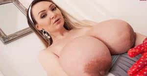 Solo model Micky Bells pulls out her massive boobs wearing polka dot gloves
