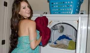 Amateur model Talia Shepard uncovers her knockers while doing laundry