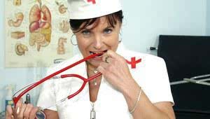 Mature nurse in stockings stretches her cunt by her fingers and speculum