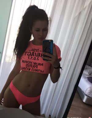 Beautiful dark haired Julia in skimpy outfits taking a sexy selfie