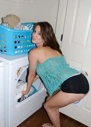 Amateur model Talia Shepard uncovers her knockers while doing laundry