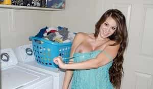 Amateur model Talia Shepard uncovers her knockers while doing laundry