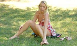 Blonde chick sticks a toy in her twat while flashing at the park