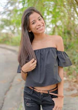 Smiley hot glamour girl Karin Torres looking sexy in ripped jeans on a swing