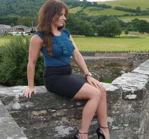 Non nude model Penny poses outside to show off her super hot legs and ankles