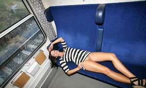 Smoking brunette Tess lifting tight dress on the train for hot naked upskirt