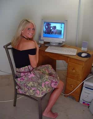Young blonde girl Spring Thomas masturbates while watching porn on computer