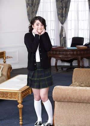 Young schoolgirl Cadence Carter posing in skirt and knee high white socks