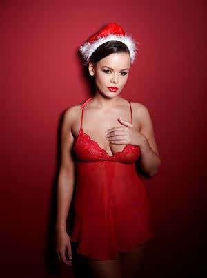 Solo girl in lingerie and Santa hat licking own nipples at Christmas