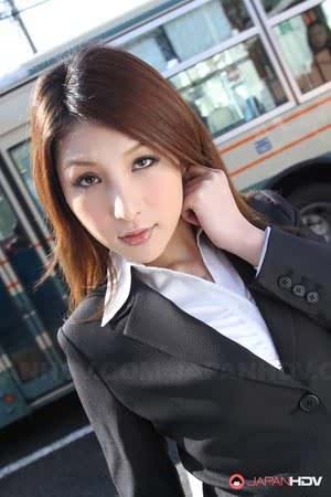 Hot redhead Japanese girl in suit poses to show her beautiful face