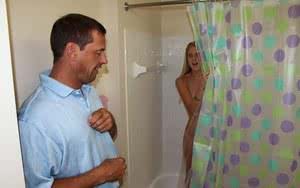 Petite blonde teen Chassity Bliss jerks off her stepdad in the shower