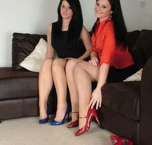 Two hot brunette girls flaunt shapely legs in sheer hose heels  mini skirts