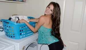 Amateur model Talia Shepard uncovers her knockers while doing laundry