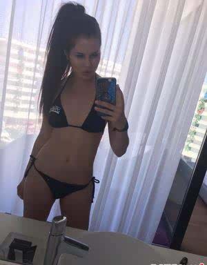 Beautiful dark haired Julia in skimpy outfits taking a sexy selfie