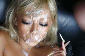 Blonde Jap chick Rina Aina taking jizz on face during bukkake session