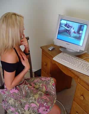 Young blonde girl Spring Thomas masturbates while watching porn on computer