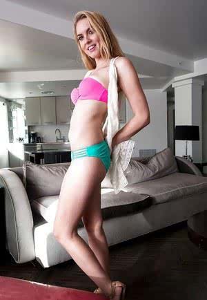 Blonde beauty Roxy Rox stripping down to pretty underwear and bra