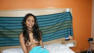 Hot Indian slut Divya removes her shirt to show her big dark nipples