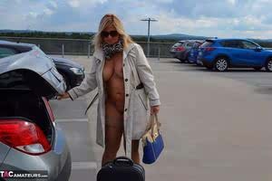 Kinky big tit mature exhibitionist wears nothing underneath coat in public