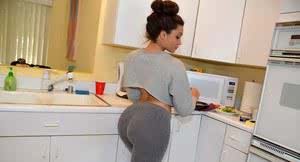 Mixed race chick looses big booty from spandex pants and thong in kitchen