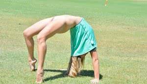 Blonde exhibitionist gets bold and takes off her dress and panties at the park