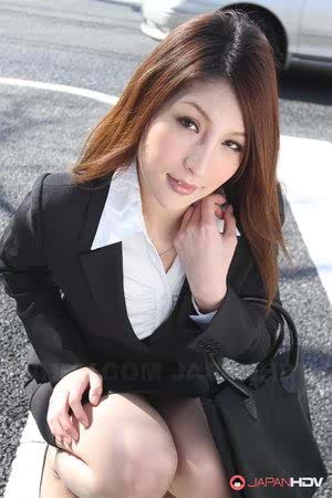 Hot redhead Japanese girl in suit poses to show her beautiful face