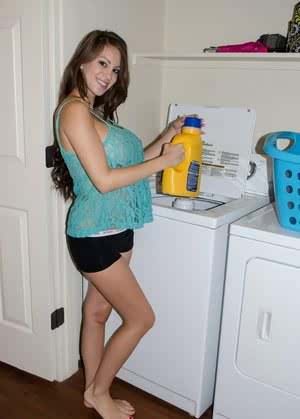 Amateur model Talia Shepard uncovers her knockers while doing laundry