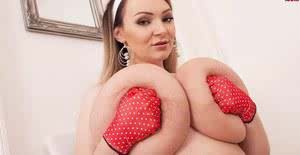 Solo model Micky Bells pulls out her massive boobs wearing polka dot gloves