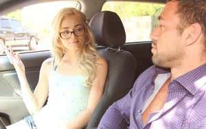 Young blonde Elsa Jean in glasses shows small tits while on knees eating cum