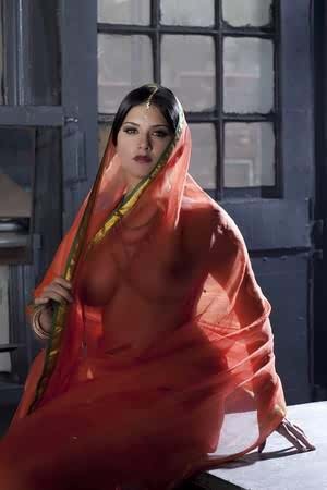 Busty solo girl Sunny Leone models solo in see thru Indian attire