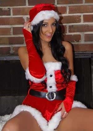 Latina female Amber Cox takes off her Xmas outfit to pose nude